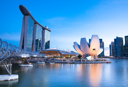 Republic of Singapore, Singapore - July 10, 2013: Sunset view of Marina Bay area with marina Bay Sands Hotel, Art Since Museum and Central Business District on the background 10 July 2013.