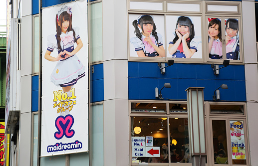 Tokyo, Japan - August 26, 2014: A maid cafe in the Akihabara district of Tokyo, also known as Electric Town. Maid cafes are a fairly recent phenomenon that has sprung up in the trendy area, and are a popular destination for locals and tourists alike.