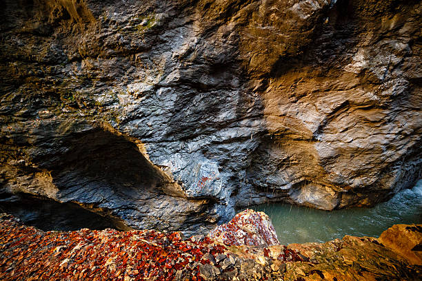 Mountain river flowing through the narrow rocky gorge