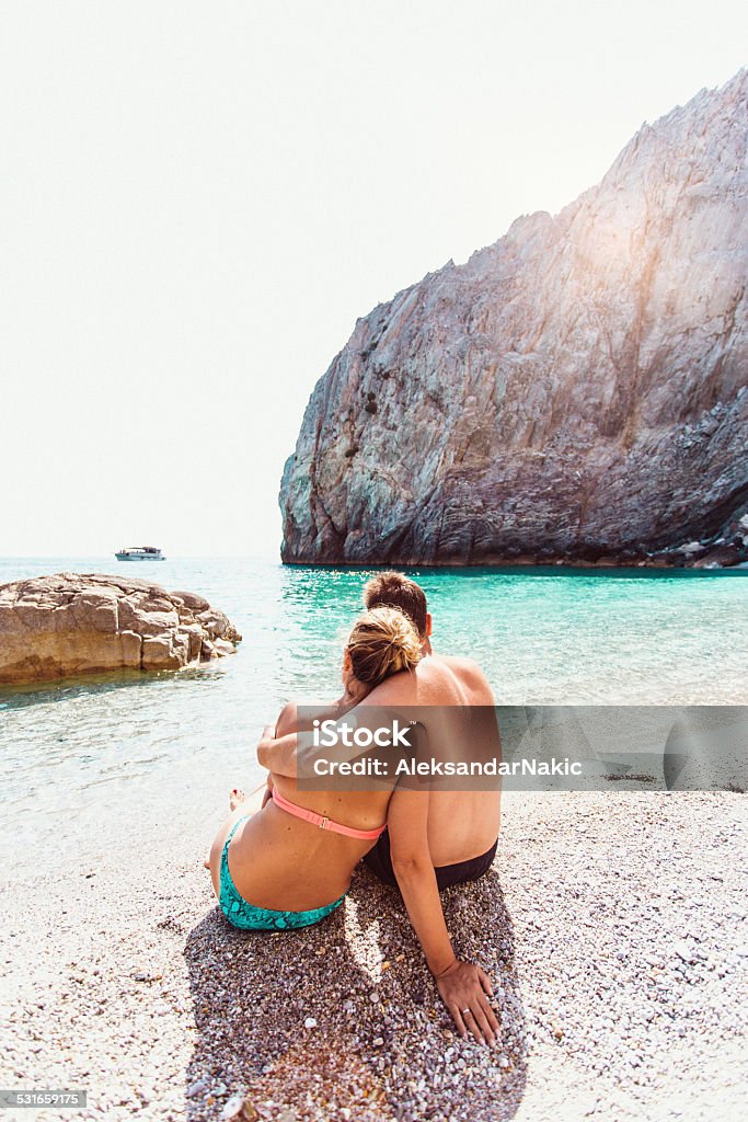 Couple enjoying the view Couple enjoying the view from the seashore 2015 Stock Photo