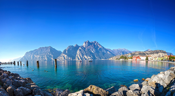 Idyllic panorama of Lake Garda and the town of Torbole in winter