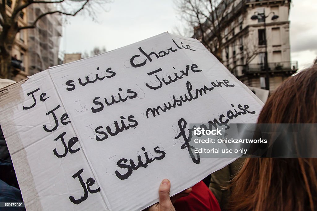 Anti-terrorism rally in Paris Paris, France - January 11, 2015: Woman with banner reading in french "I am Charlie I am Jewish I am muslim I am french" during the anti-terrorism rally in Paris. Charlie Hebdo Stock Photo