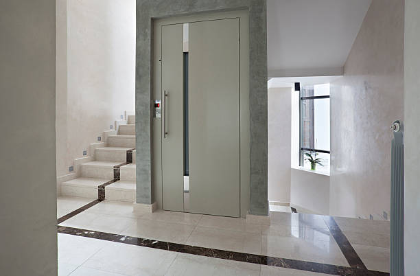 istock Elevator and stairs in building 531671371