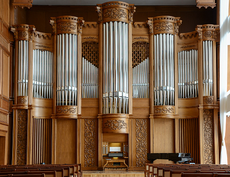 Modern concert hall with a beautiful facade of a large organ