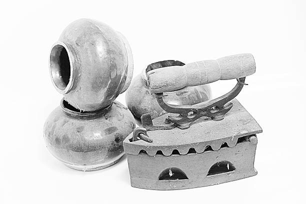 istock Old iron and old jar and Rocks on white background 531672301