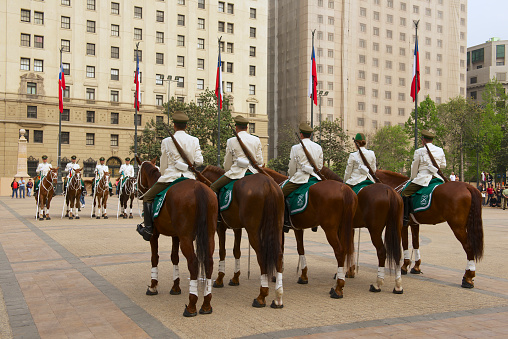 Santiago, Chile - October 18, 2013: Unidentified military of the Carabineros band attend  changing guard ceremony in front of the La Moneda presidential palace on October 18, 2013 in Santiago, Chile.