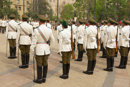 Santiago, Chile - October 18, 2013: Unidentified military of the Carabineros band attend  changing guard ceremony in front of the La Moneda presidential palace on October 18, 2013 in Santiago, Chile.