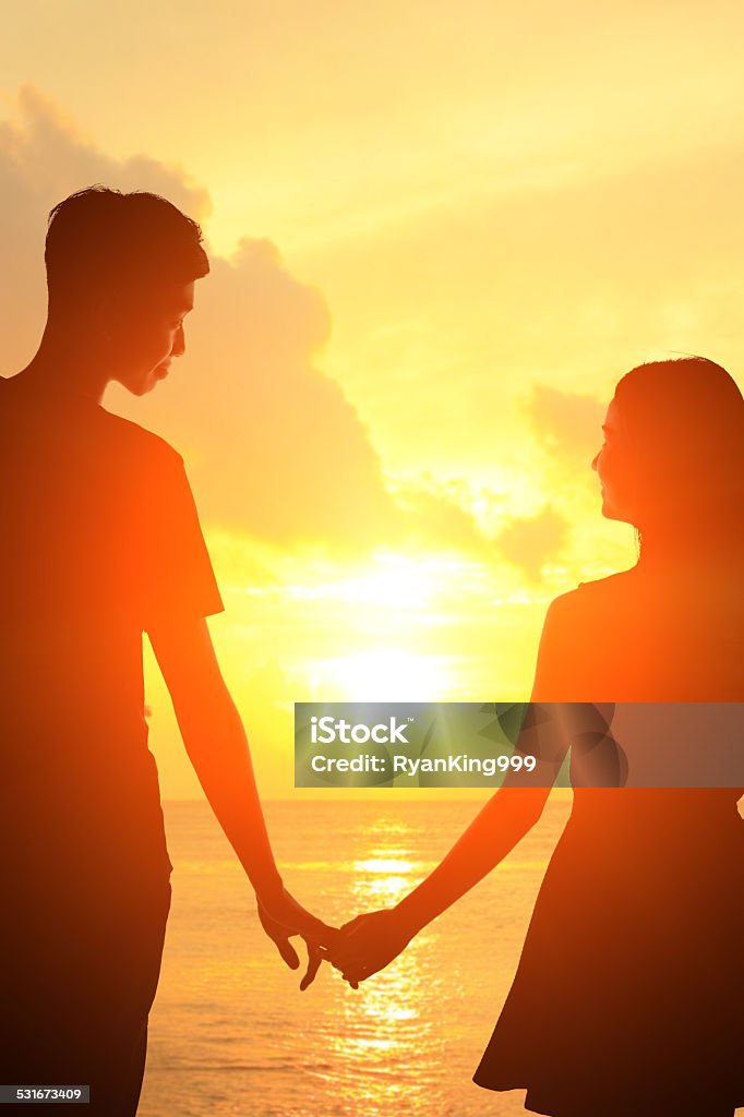 Romantic lovers in Maldives silhouette of romantic lovers hug with sea ocean in Maldives with sunset 2015 Stock Photo