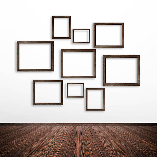 istock Wooden photo frames on white wall inside the room 531673521