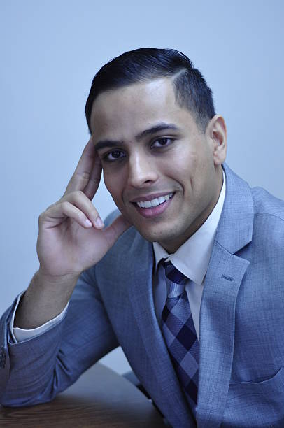 istock Handsome Businessman with Hand on Face Smiling 531675461