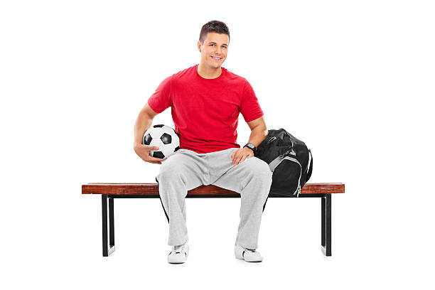 istock Young football player sitting on a bench 531677717