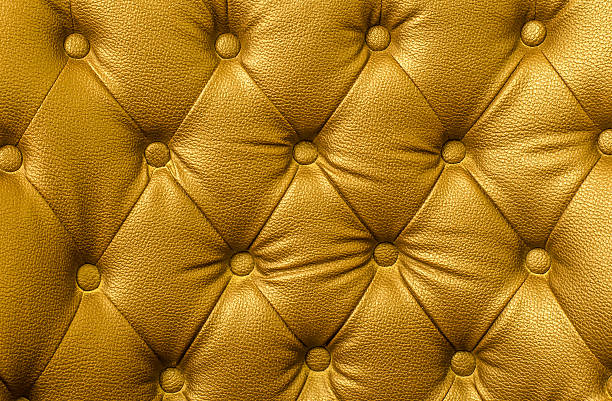 istock Texture of gold leather vintage sofa for background 531686484