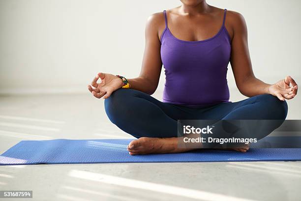 Lotus Position Stock Photo - Download Image Now - African Ethnicity, Exercise Mat, Sitting