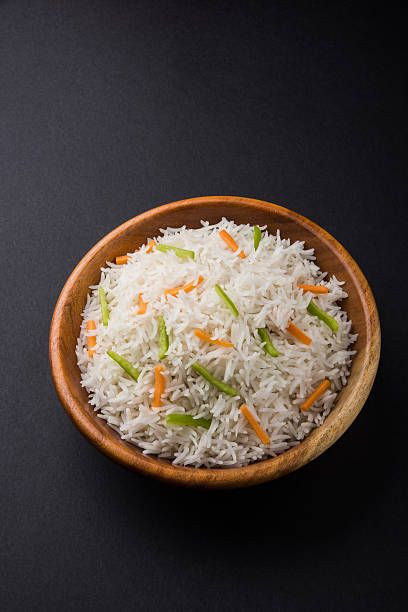 istock cooked white basmati rice with carrot and capsicum toppings 531690784