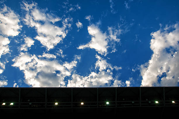 istock Football Stadium Horizontal against clear blue sky with clouds. 531691197