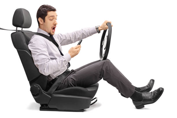 istock Man driving and texting on his phone 531692804
