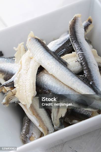 Pickled Anchovies In White Dish Stock Photo - Download Image Now - 2015, Anchovy, Appetizer