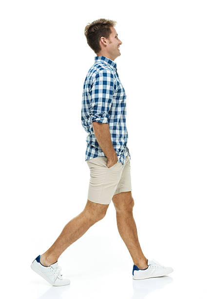istock Smiling man in checked shirt & walking 531693357