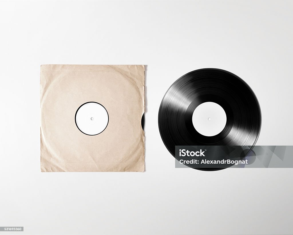 Blank vinyl album cover sleeve mockup, isolated, clipping path Blank vinyl album cover sleeve mockup, isolated, clipping path. Gramophone music plate clear surface mock up. Paper sound shellac disc label template. Vintage old grunge cardboard vinyl disk packaging Record - Analog Audio Stock Photo