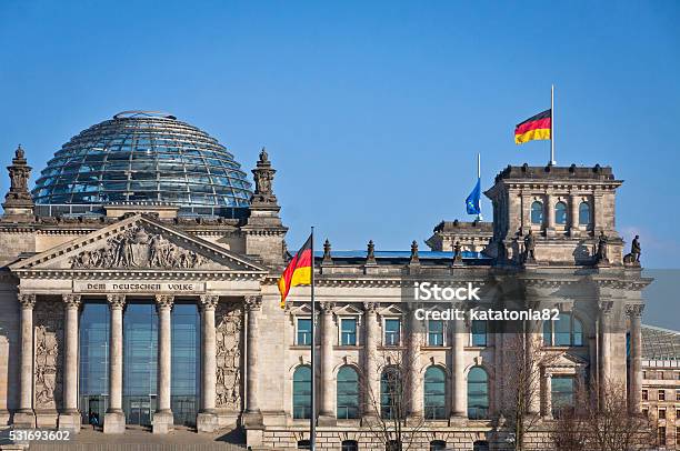 German National Flags Waving In Front Of German Parliament Buildi Stock Photo - Download Image Now