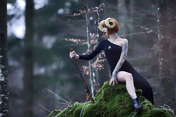 Aries woman portrait in the wild woods Young woman with aries hors in whe wilderness aries stock pictures, royalty-free photos & images