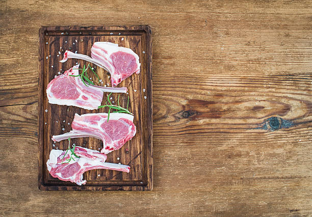 istock Rack of Lamb with rosemary and spices on rustic chopping 531694084