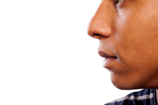 close up shot of the nose and mouth of a dark-skinned young man