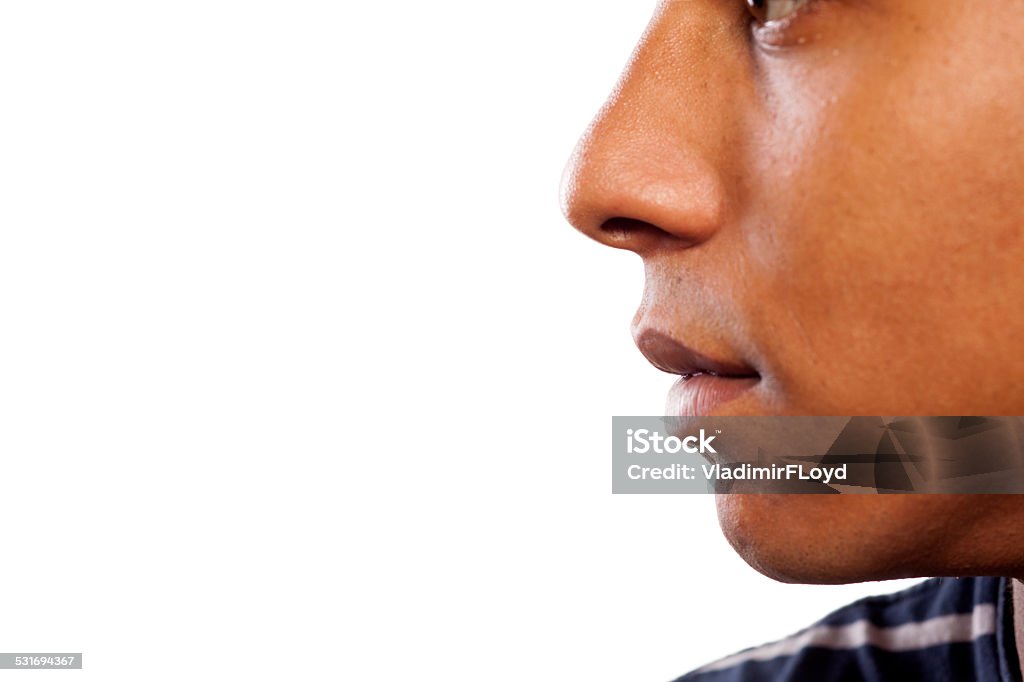 Nose and mouth of a dark-skinned young man close up shot of the nose and mouth of a dark-skinned young man Nose Stock Photo