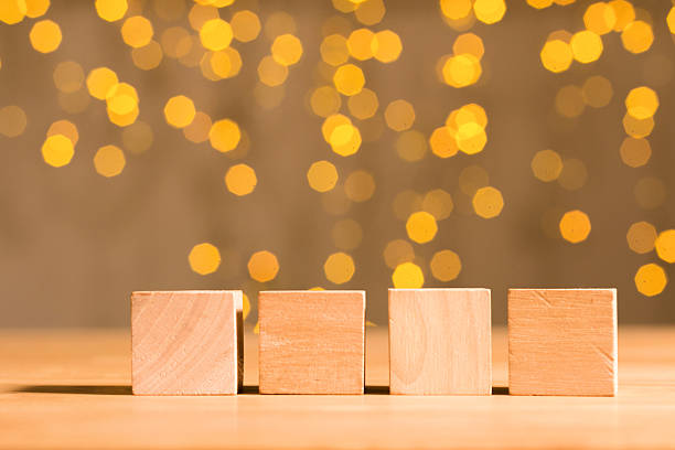 istock Four wooden cubes on flare background 531695649