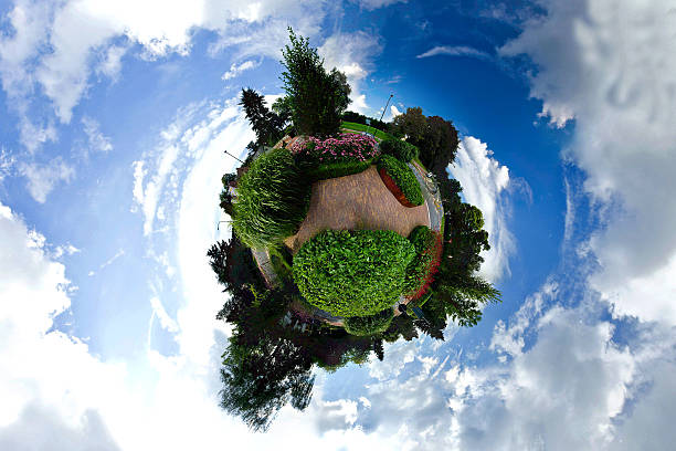 istock Tiny green planet. Miniature planet of park with trees, flowers 531696701