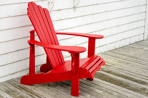 istock Red Adirondack Chair on a Patio 531696784