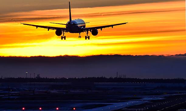 istock Airplane night landing to runway 531697471