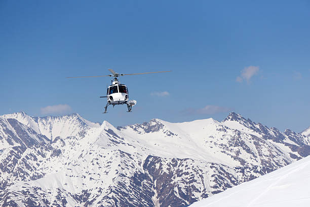 istock White rescue helicopter  in the mountains 531697510