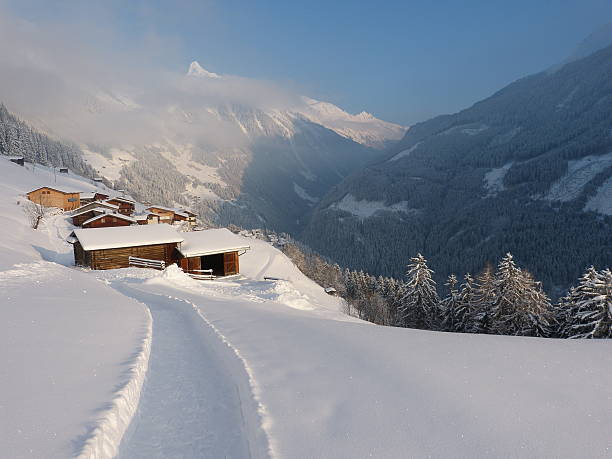 istock snowy path to the mountain village 531697763