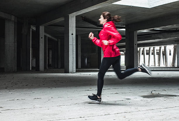 istock Young woman running 531697844