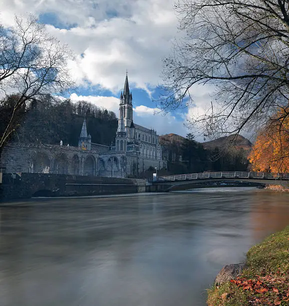 Photo of Sanctuaries of Lourdes from the border of Gave de Pau River