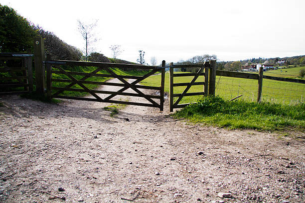 istock Wooden gate across a path in the countryside 531699020