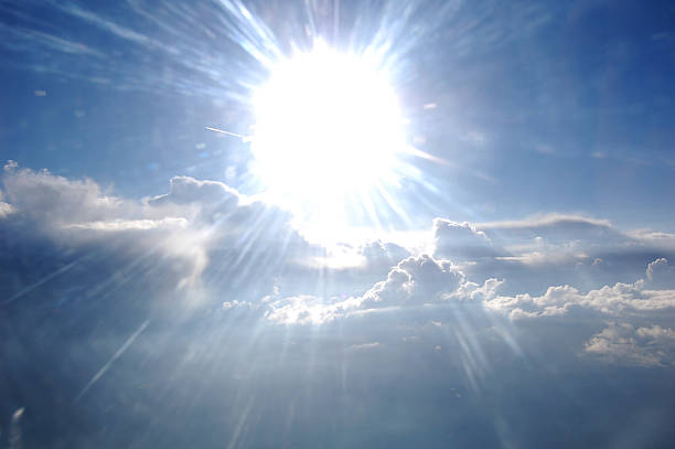 istock Clouds, sun, sky as seen in window of an aircraft 531699376