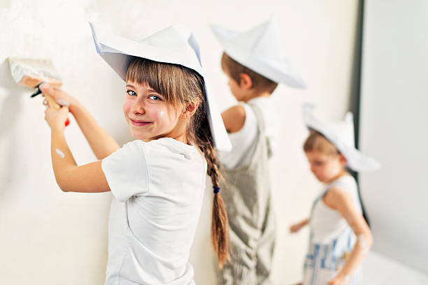 istock Kids painting their room white 531700324