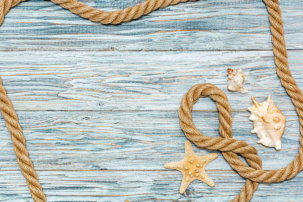 istock Marine rope and starfish on white boards 531700946
