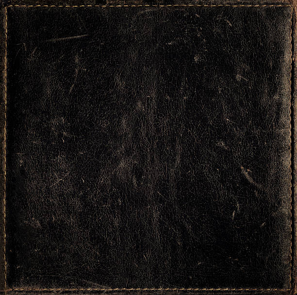 istock Black grunge background from distress leather texture with stitched frame 531701010