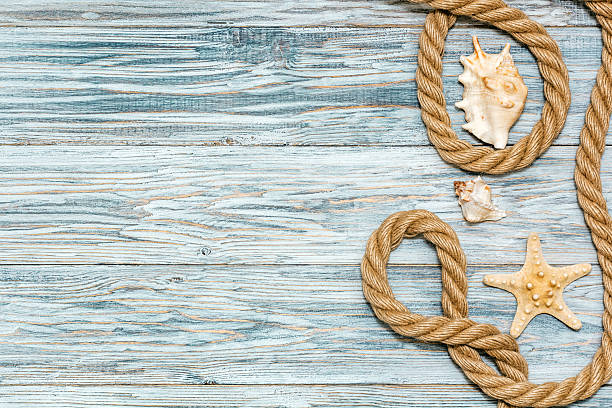 istock Marine rope and starfish on white boards 531701454