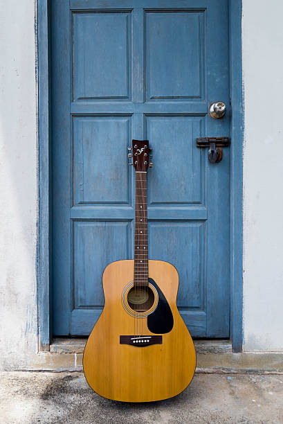istock Guitar on vintage door 531701780