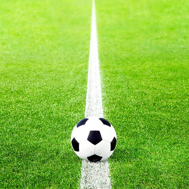 istock Soccer ball on green grass 531701994