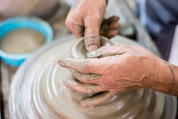 istock Clay potter creating on the pottery wheel 531702436