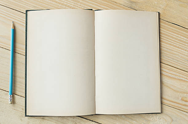 istock blank paper with pencil wooden table background 531704084