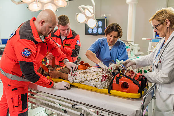 istock Paramedics and doctors in operating theatre 531704220