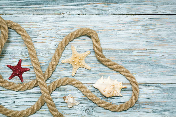 istock Marine rope and starfish on white boards 531705048