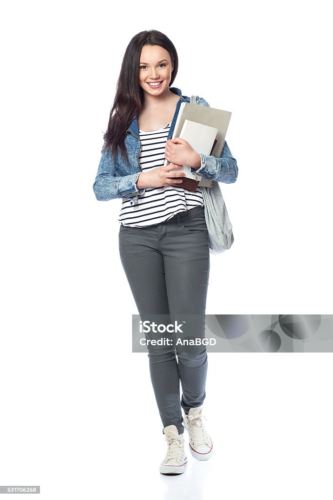 Happy student girl Young female student standing with books and bags, isolated on white White Background Stock Photo