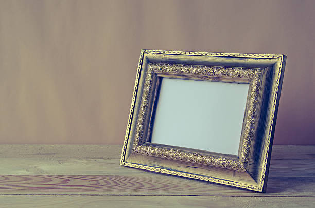 istock blank photo frame on wooden table 531706756